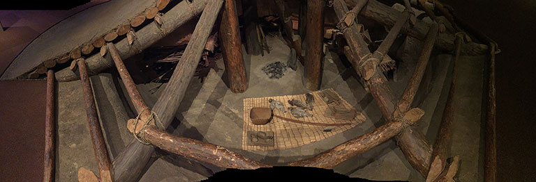 A modern replica of the interior of a pit house.