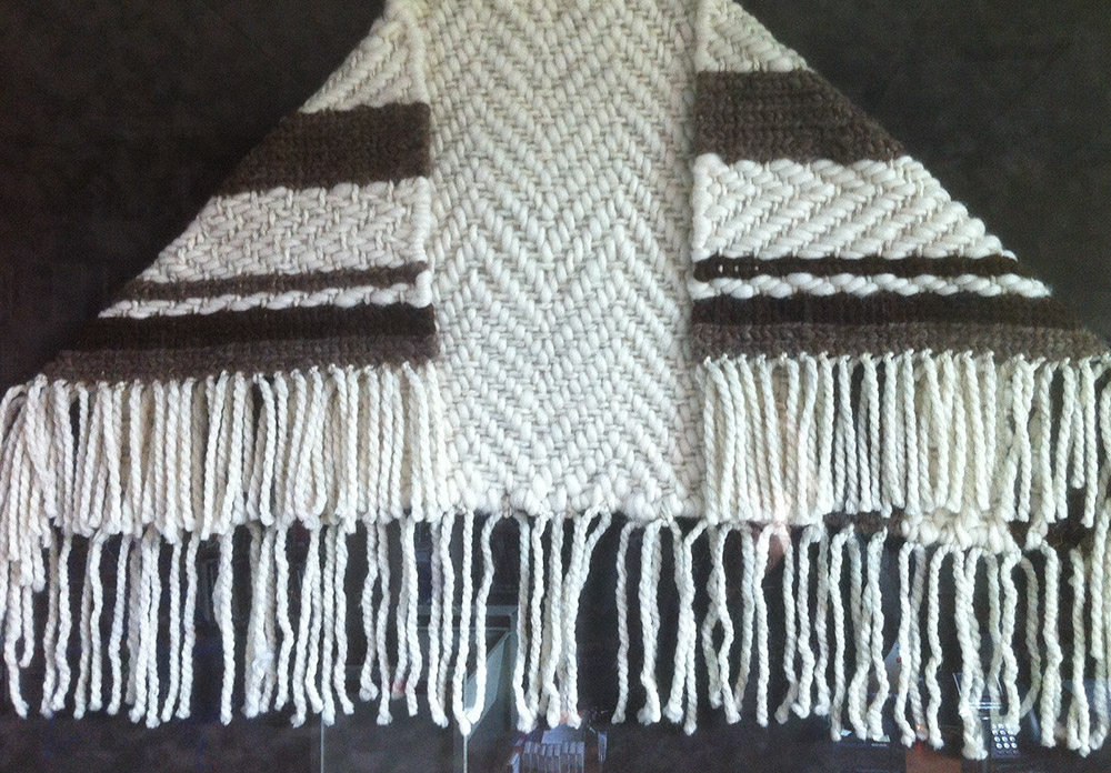 A woven blanket folded for an honouring ceremony